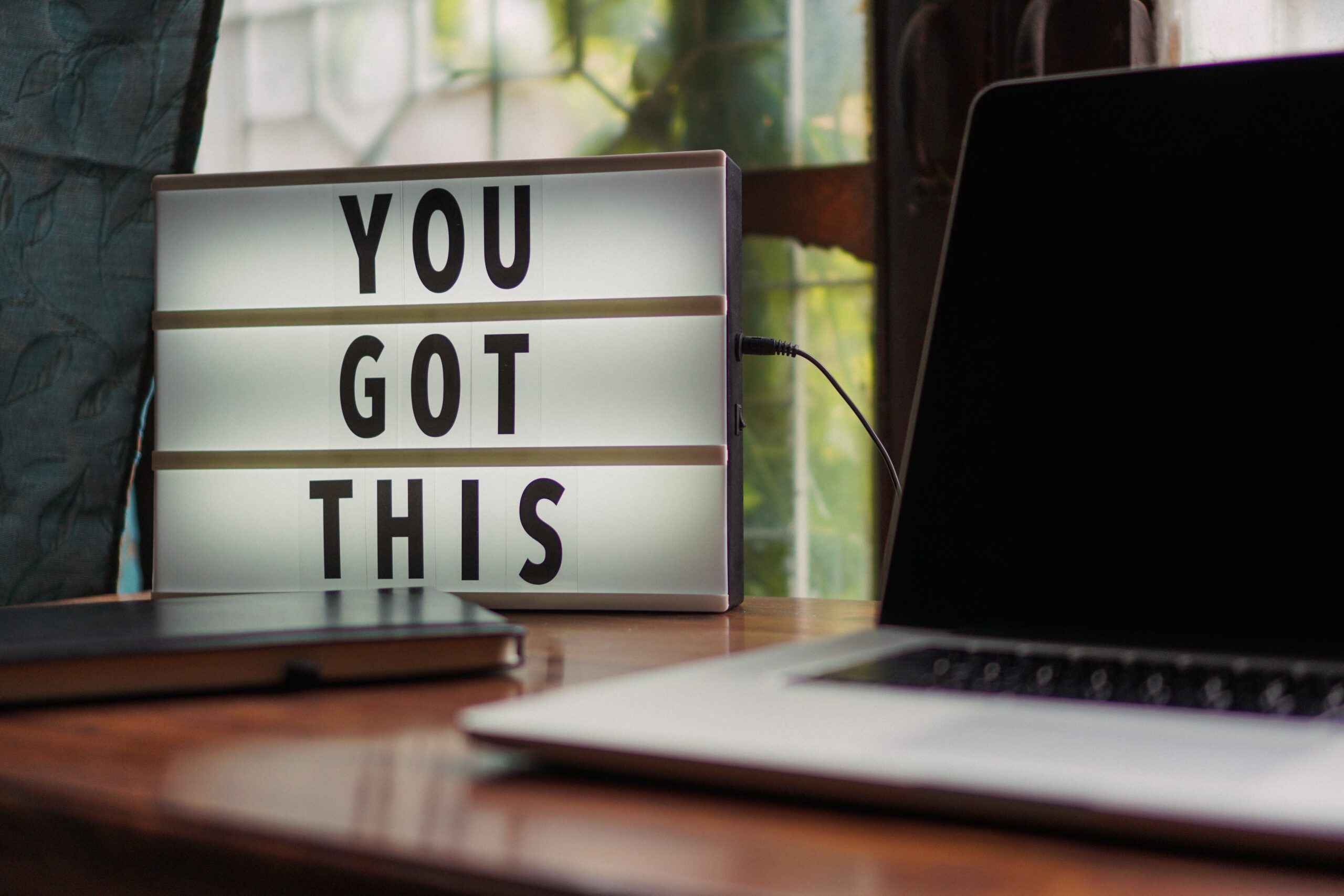 Sign on a desk that says You Got This